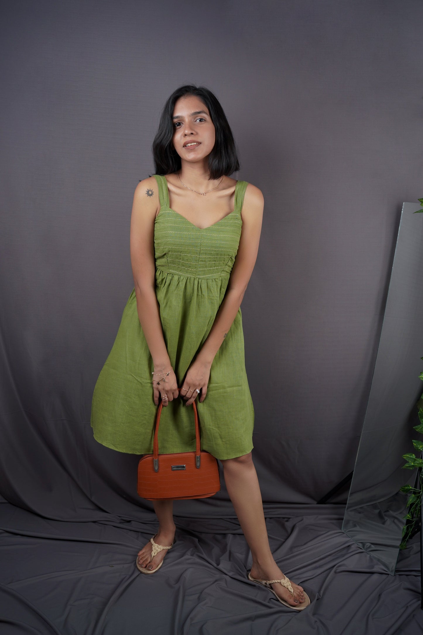 Olive green strap dress.
