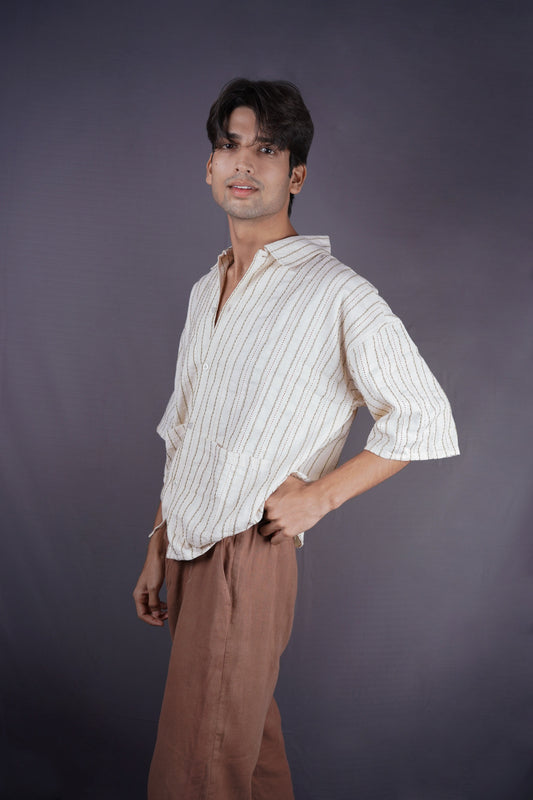Ivory all-over threadwork oversized shirt.