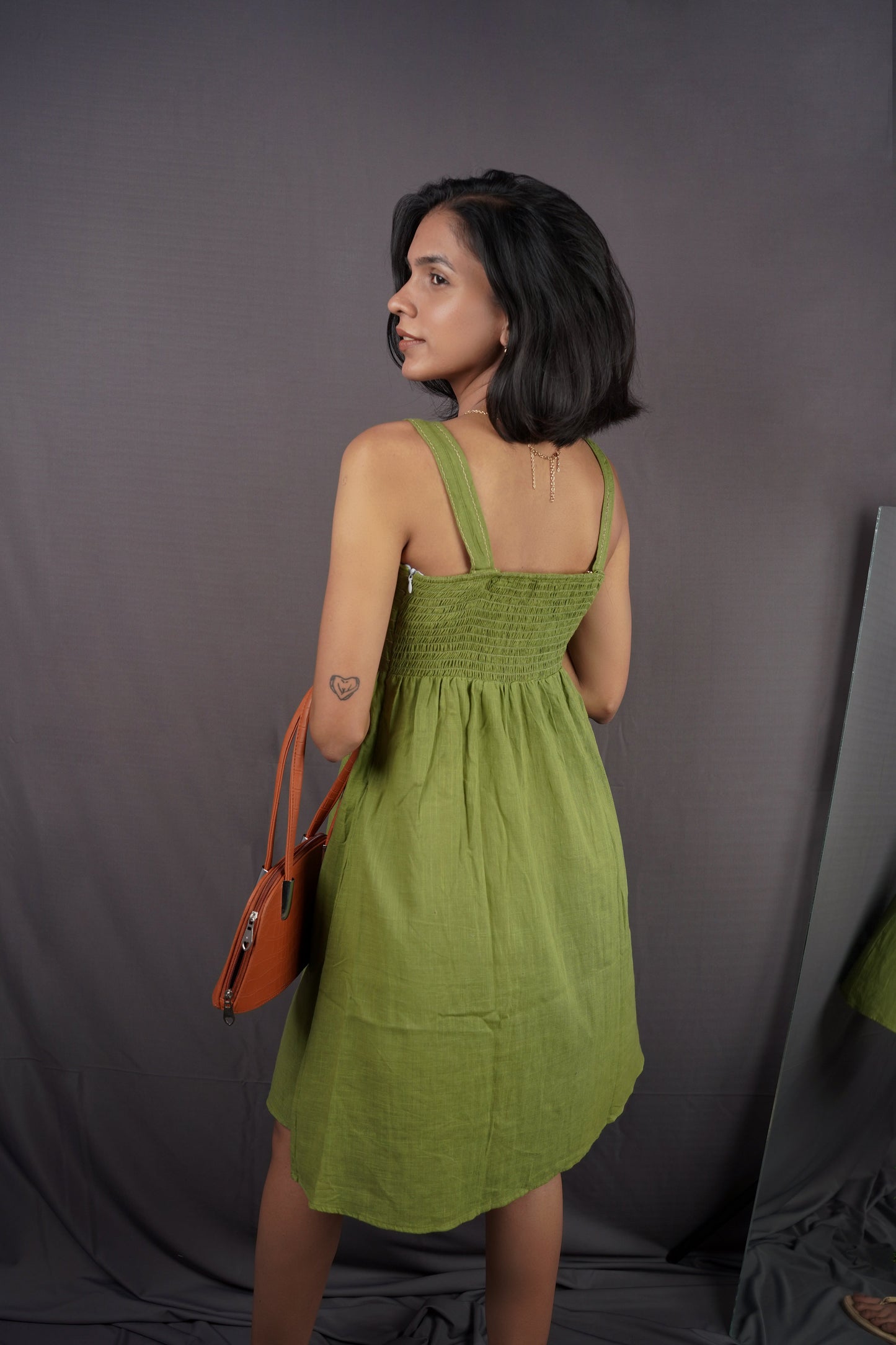 Olive green strap dress.